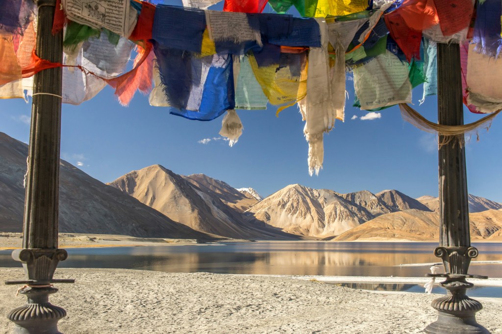 Ladakh mountain lake with colorful prayer flags