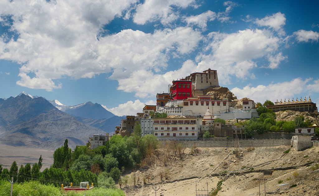 Thiksey Monastery on a hilltop surrounded by mountains in Ladakh