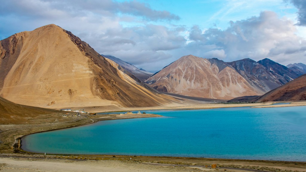 Pangong Tso lake surrounded by mountains in Ladakh
